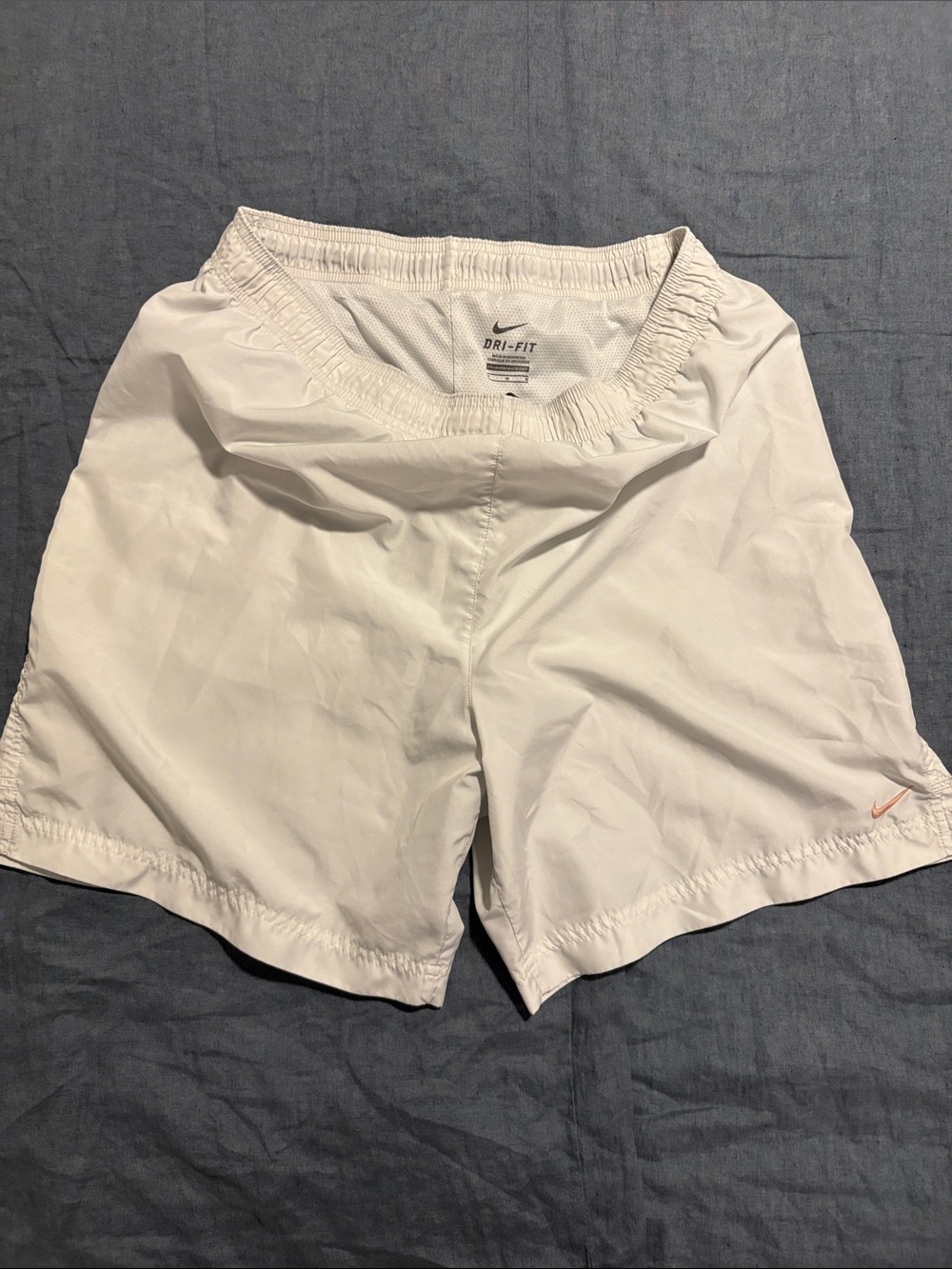Nike Dry-Fit Lined White Women's Athletic Shorts with Subtle Orange Swoosh